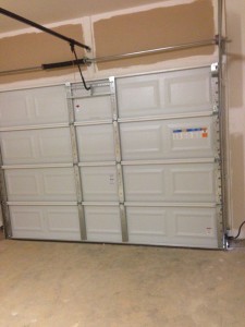 The Single Garage Door (with auto opener) has been installed.