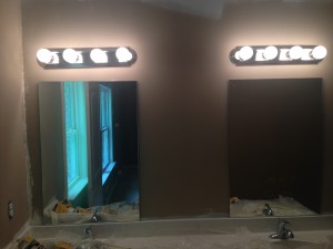 Master Bathroom with dual vanities and dual mirrors/lights.  